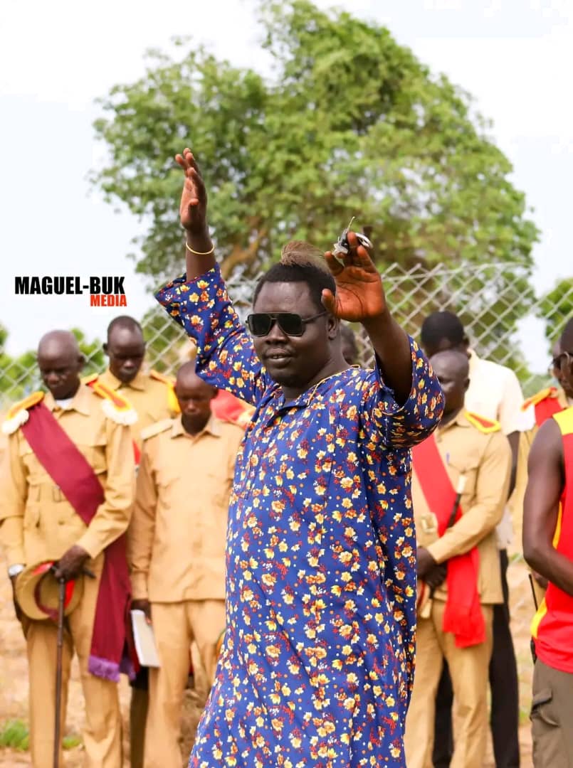 Community participant raising a hand during a public gathering